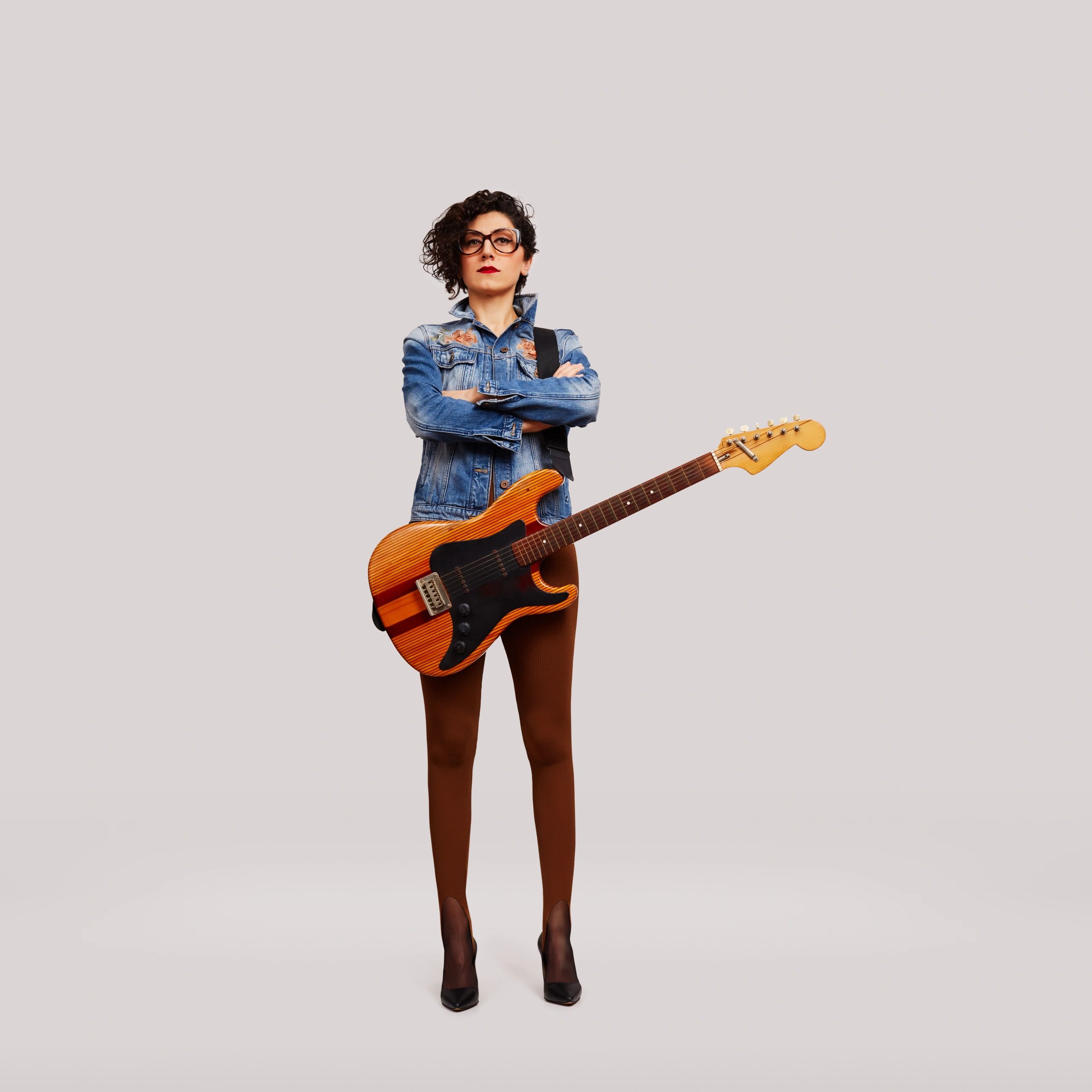 Musician holding a guitar portrait