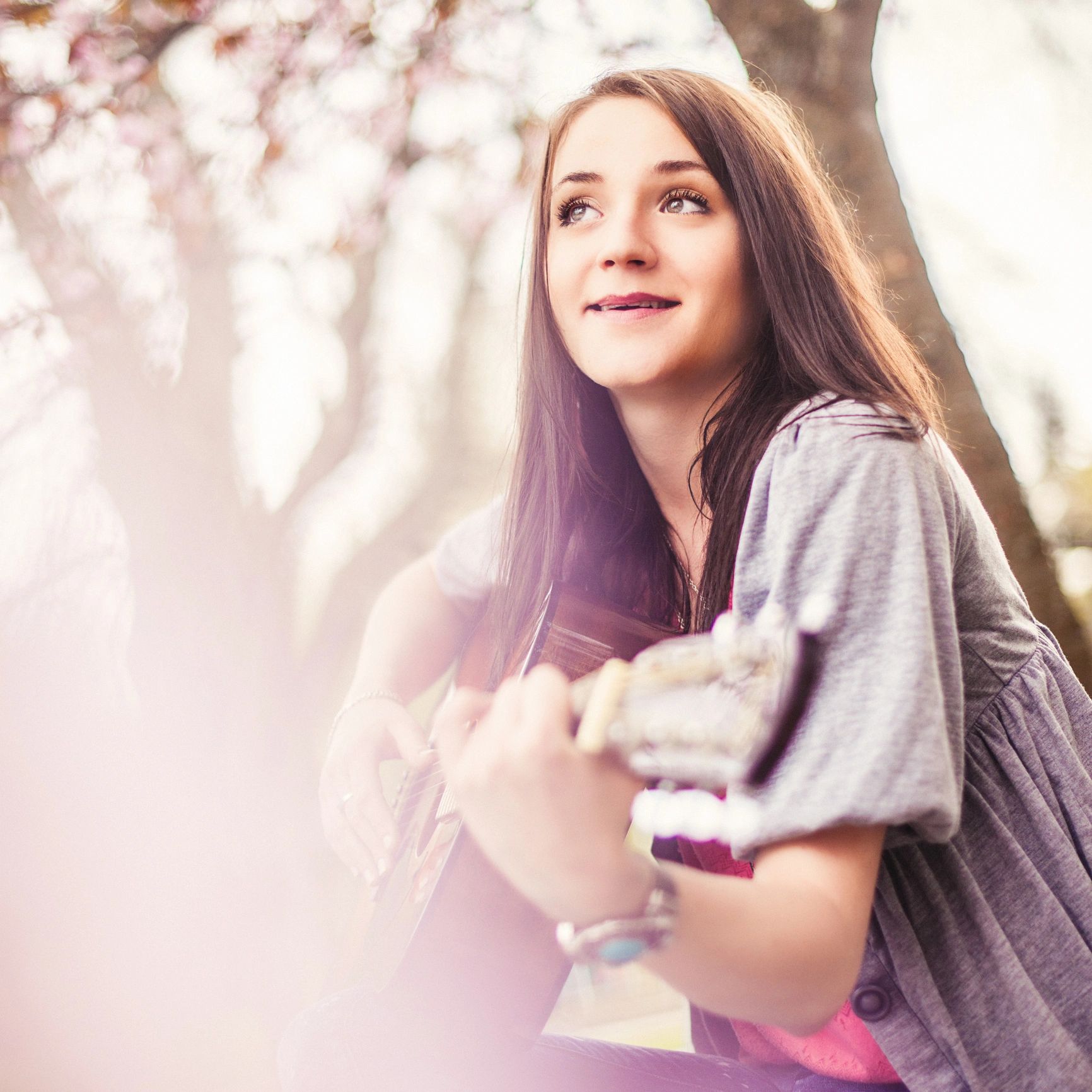 Smiling musician with guitar portrait