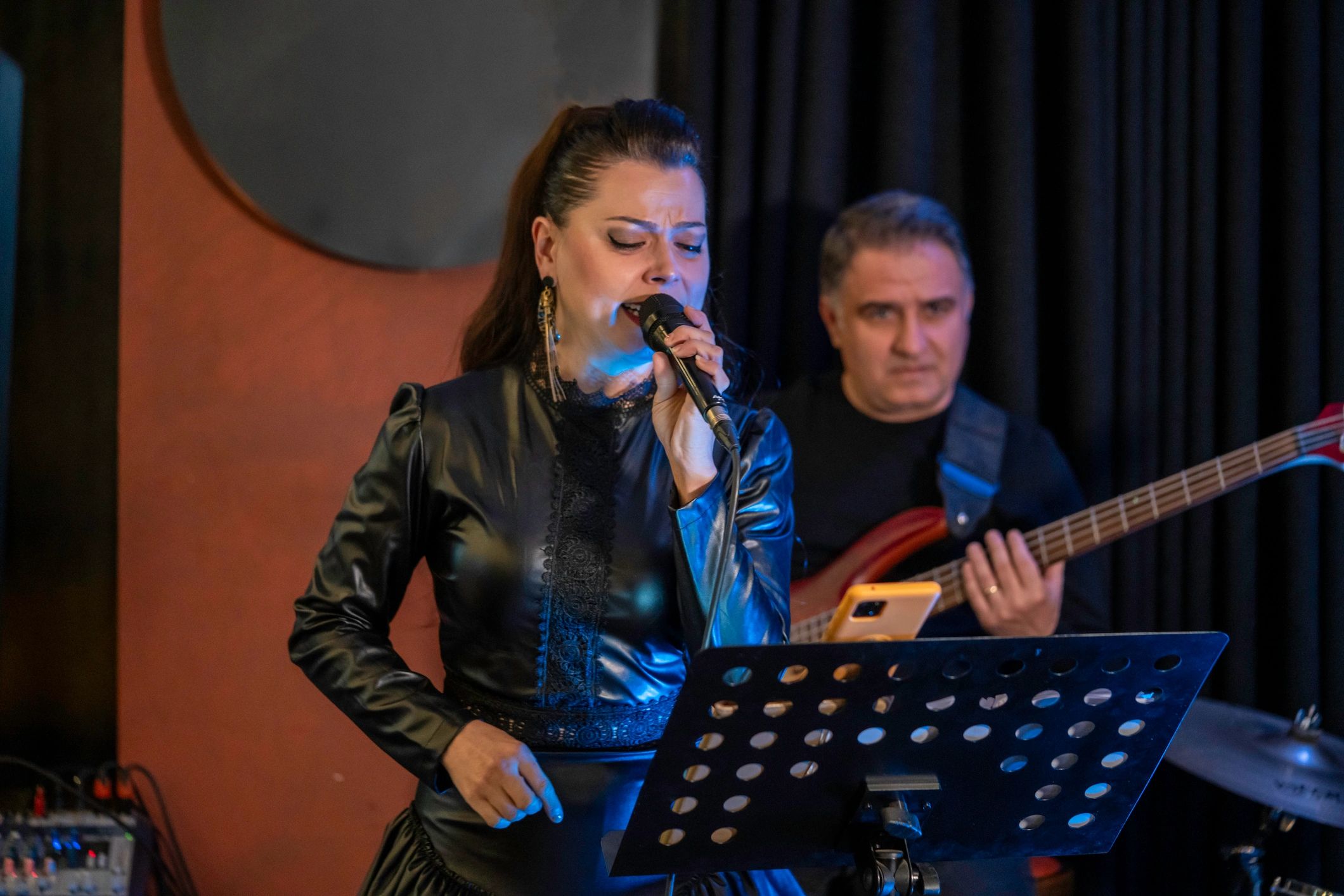 Acoustic duo performing with microphones
